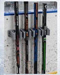 Supports pour bâtons de hockey
